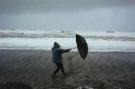 Why is it important to prepare for inclement weather, and how does it relate to the unexpected joy of finding a forgotten umbrella?